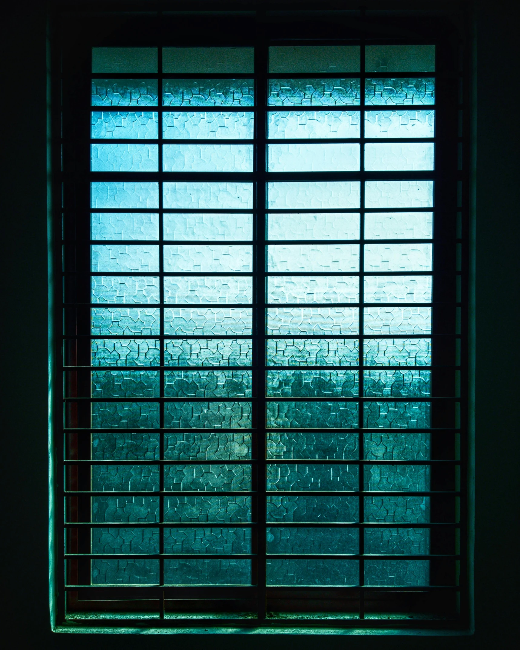 a picture of a window in a dark room, inspired by Elsa Bleda, unsplash contest winner, blue and green water, cell bars, square lines, glossy from rain