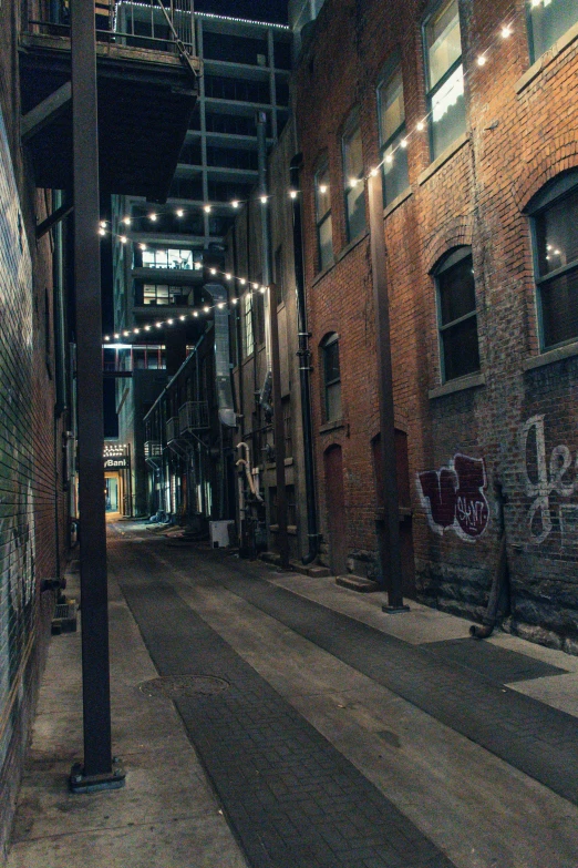 a street filled with lots of graffiti next to tall buildings, unsplash contest winner, in an alley at night back lit, california;, empty streetscapes, cleveland