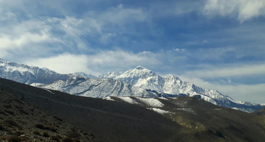 a mountain range with snow covered mountains in the distance, pexels contest winner, hurufiyya, thangka, photo on iphone, 3/4 view from below, very high resolution