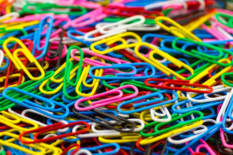 a pile of colorful paper clips sitting on top of each other, by Kazimierz Wojniakowski, pexels, maximalism, find the hidden object, 🧒 📸 🎨, hunting, magnetic