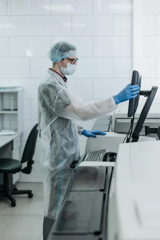 a man in a lab coat working on a computer, clean medical environment, thumbnail, inspect in inventory image, taken in 2022