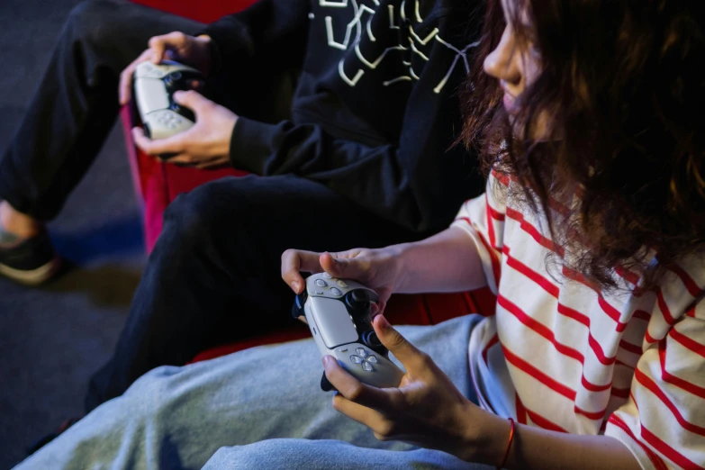 two people sitting on a couch playing a video game, playstation 1 game, taken with sony alpha 9, style game square enix, multicoloured