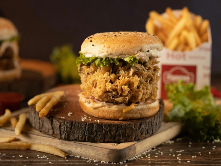 a chicken sandwich sitting on top of a wooden cutting board, hurufiyya, with fries, monsoon, various posed, medium level shot