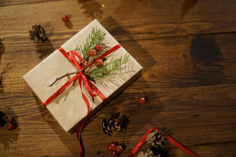 a christmas present sitting on top of a wooden table