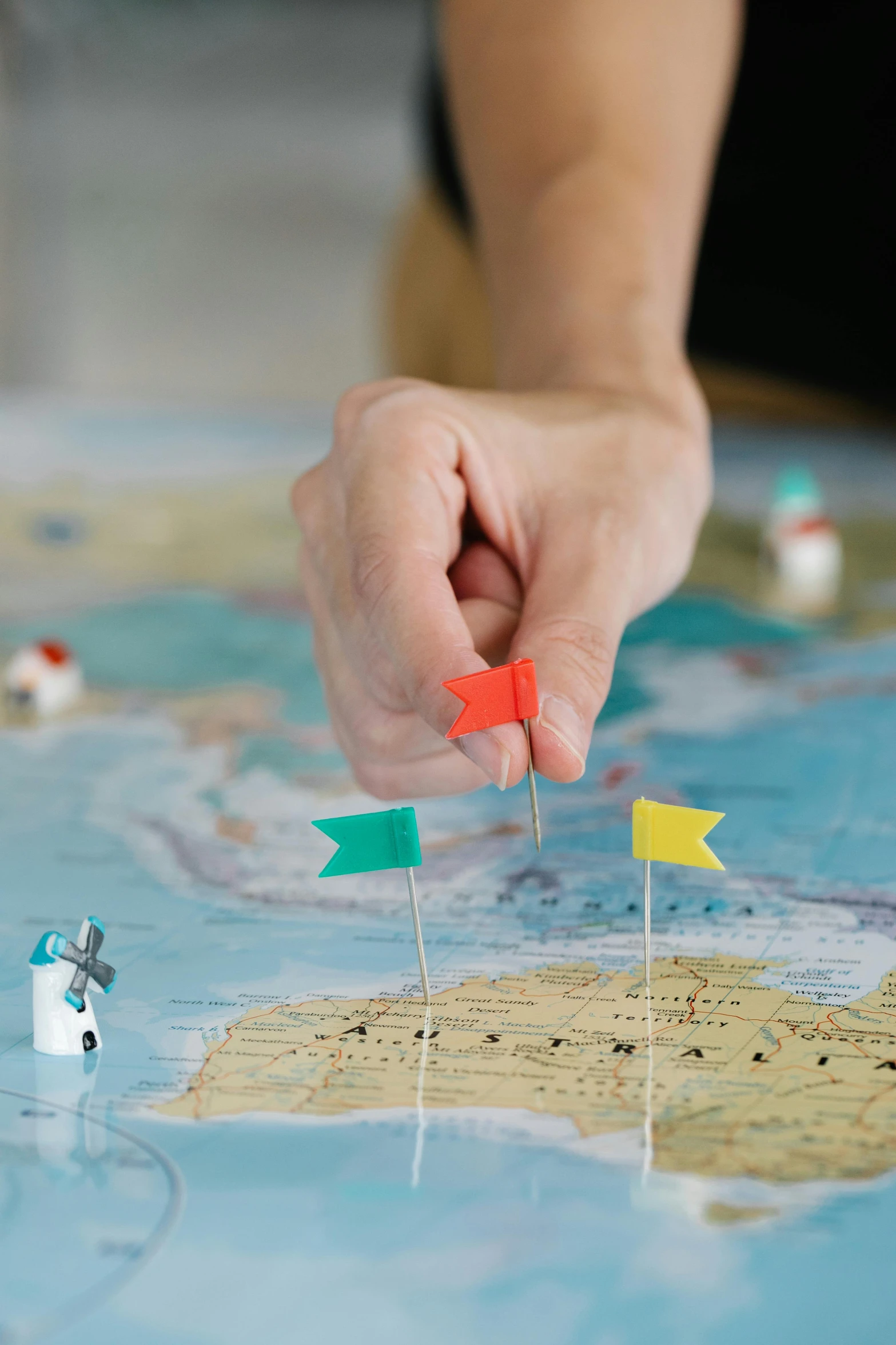 a close up of a person playing a game on a map, flags, full product shot, mini model, grey