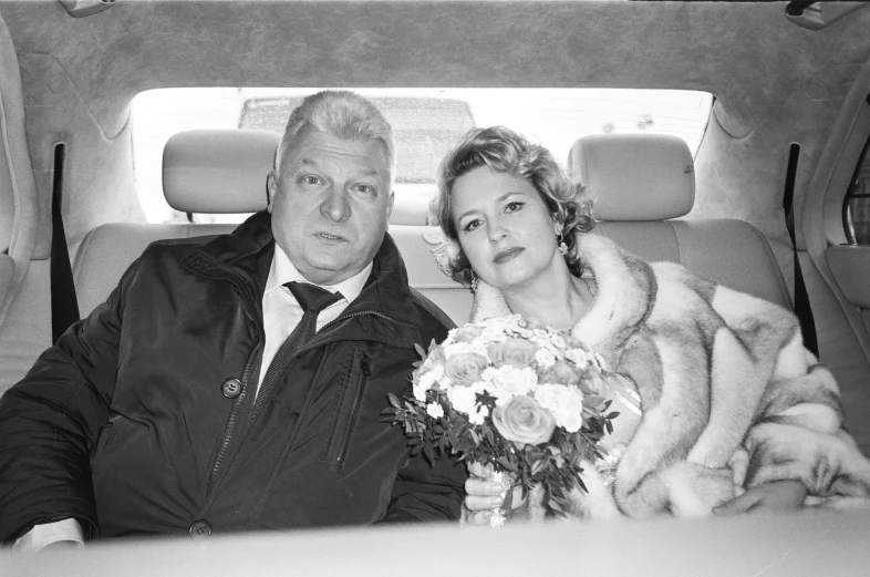 a man and woman sitting in the back of a car, by Maksimilijan Vanka, flickr, groom, yeltsin, gregoire and manon, vitaliy bondarchuk