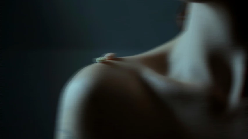 a close up of a person holding a toothbrush, inspired by Elsa Bleda, featured on cgsociety, digital art, showing her shoulder from back, todd hido, movie still 8 k, beads cross onbare chest