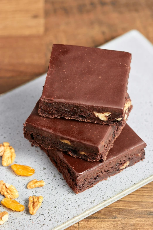 a stack of brownies sitting on top of a plate, inspired by Isidore Bonheur, smooth matte, 6 pack, eco, three quarter angle