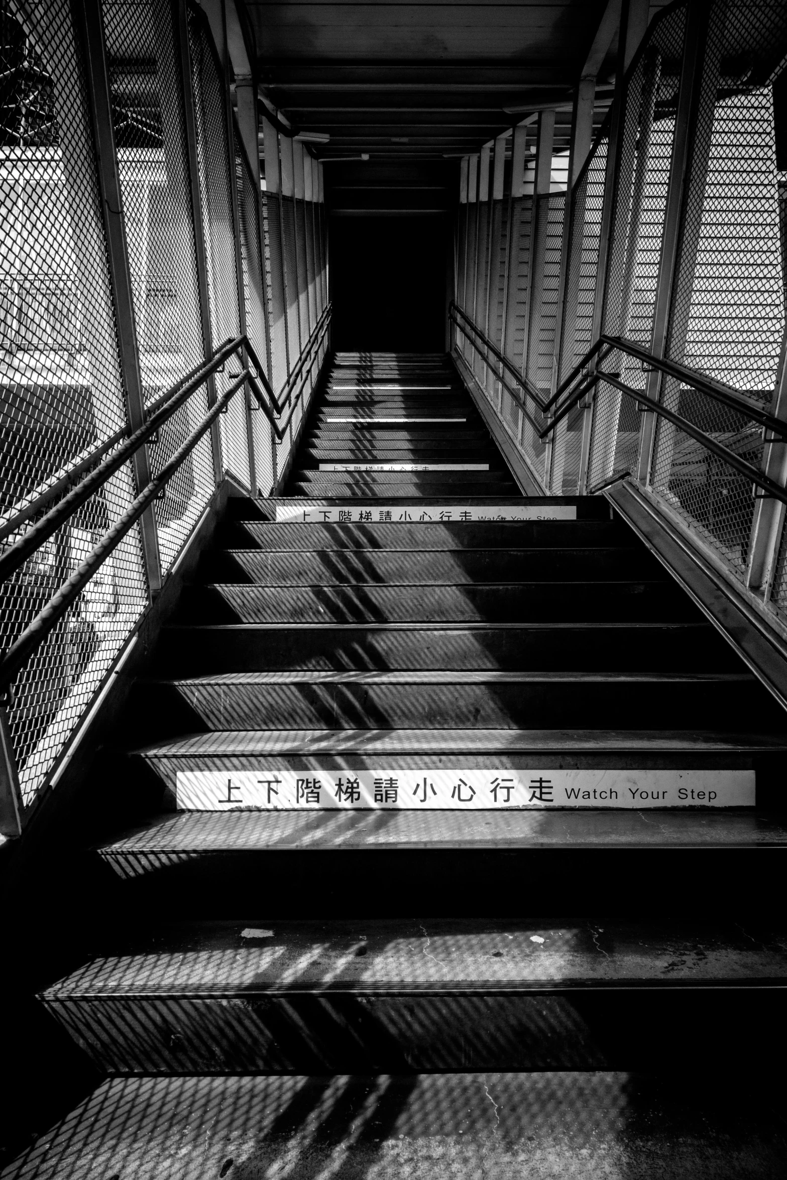 a black and white photo of a set of stairs, inspired by Yamaguchi Kayo, flickr, train station, warning, photo taken in 2 0 2 0, [ realistic photo ]!!