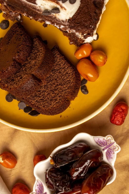 a piece of cake sitting on top of a yellow plate, a still life, by Bernardino Mei, shutterstock contest winner, renaissance, brown bread with sliced salo, dubai, chili, panoramic shot