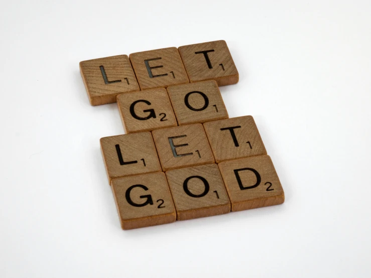 wooden scrabbles spelling let go let god, an album cover, inspired by Leo Goetz, letterism, - 12p, ptsd, hegre, getty images