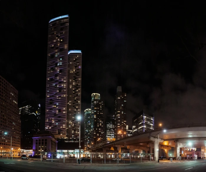 a city street filled with lots of tall buildings, by William Berra, pexels contest winner, renaissance, nighttime, panoramic, three towers, chicago