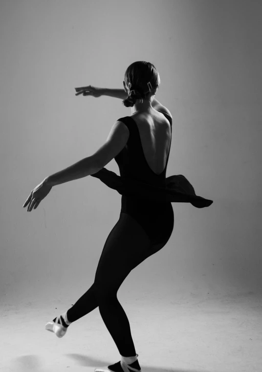 a woman in a black leo leo leo leo leo leo leo leo leo leo leo leo leo, a black and white photo, by Caro Niederer, arabesque, promo image, medium format. soft light, profile pic, various pose