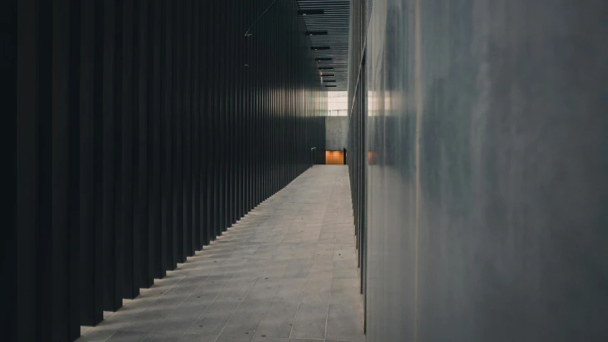 an image of a hallway in a building, an album cover, inspired by David Chipperfield, unsplash contest winner, iron cladding, dark grey and orange colours, from street level, instagram post