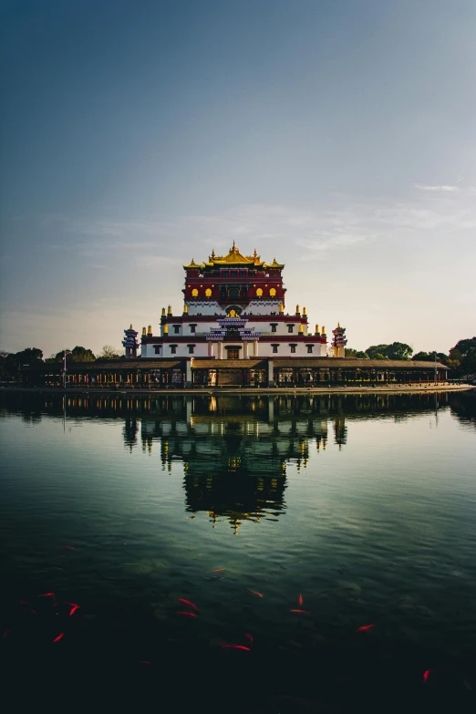 a large building sitting on top of a body of water, by Reuben Tam, pagoda, exterior, panorama, square