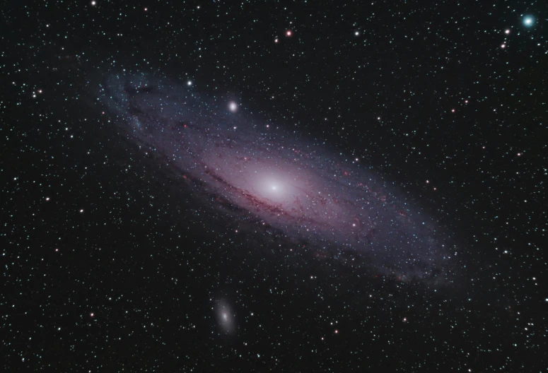 a close up of a galaxy with stars in the background, by David Michie, pexels, andromeda, taken in the late 2010s, the non-binary deity of spring, 200mm wide shot