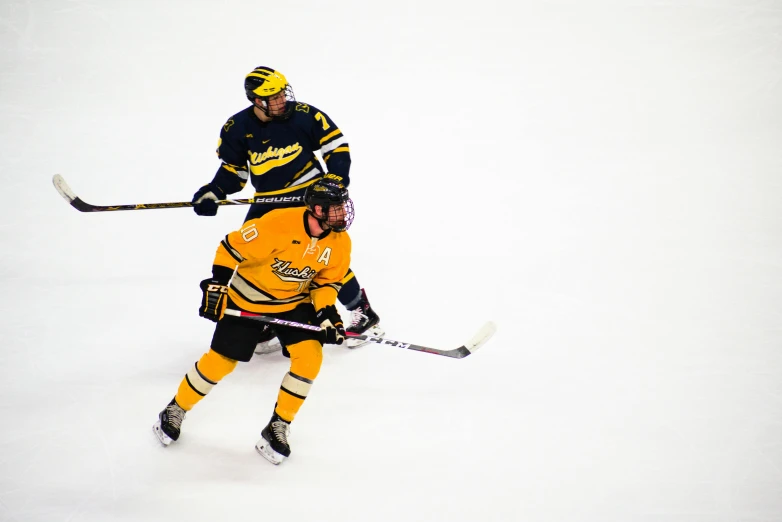 a couple of men playing a game of hockey, unsplash, happening, black and yellow colors, mitch foust, iu, taken in the late 2010s