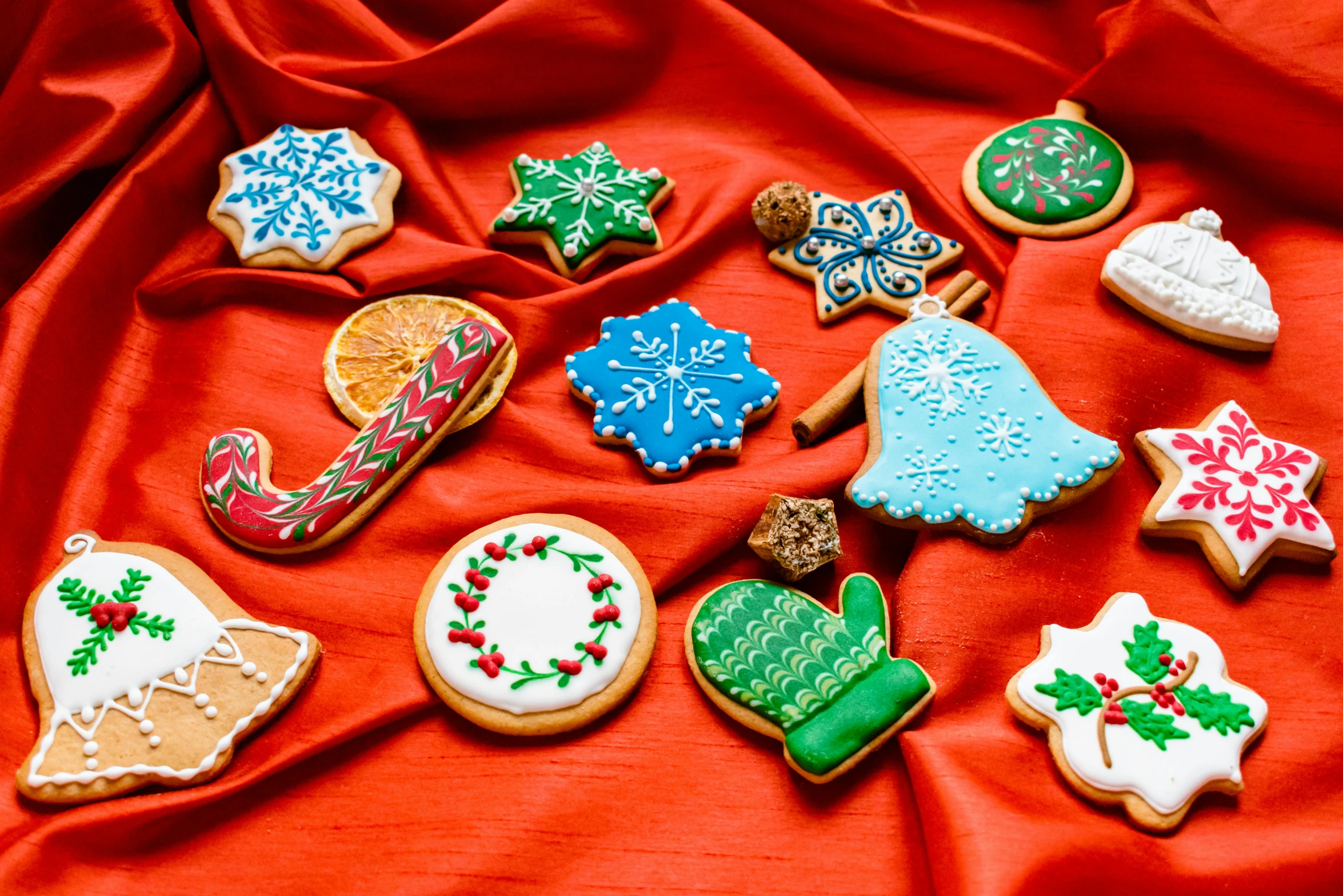 a bunch of decorated cookies on a red cloth, by Julia Pishtar, fan favorite, 3 4 5 3 1, ornamented, medium