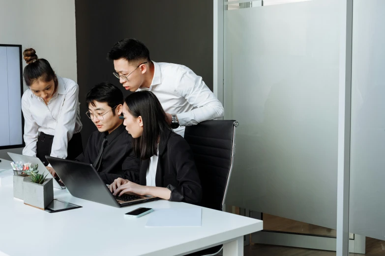 a group of people looking at a computer screen, by Jang Seung-eop, pexels contest winner, bending down slightly, ceo, ignant, cover corp