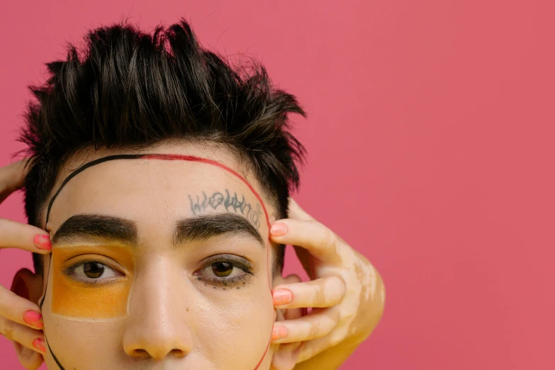 a close up of a person with a painted face, an album cover, trending on pexels, androgynous male, surgery, asian human, eyebrows