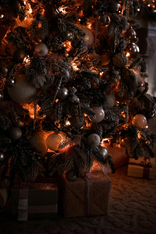 a lit christmas tree in front of a fireplace, a digital rendering, pexels, baroque, portrait closeup, dark grey and orange colours, ivory and copper, detailed cinematic shot