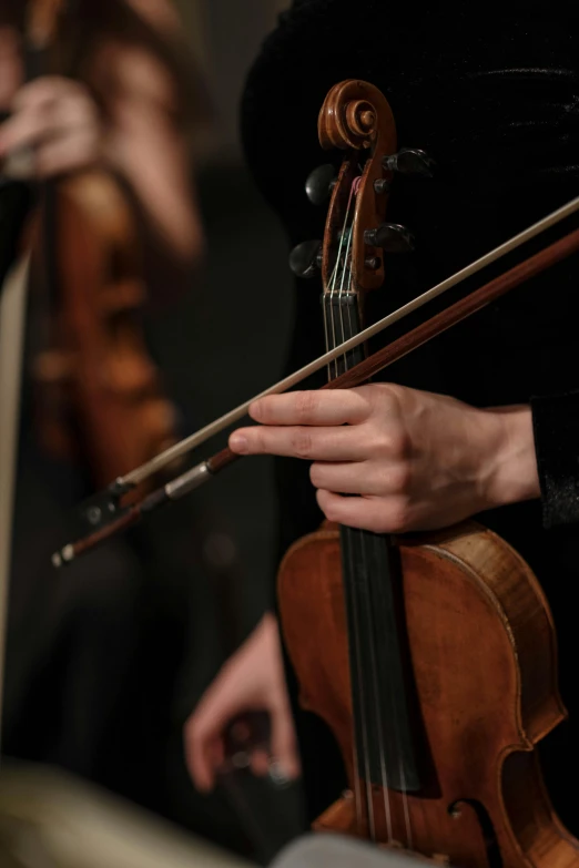 a close up of a person holding a violin, musicians playing instruments, unedited, caparisons, strathmore 2 0 0