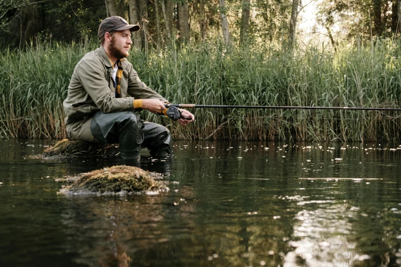 a man sitting on a rock with a fishing rod, hunters gear, walton ford, thumbnail, lookbook