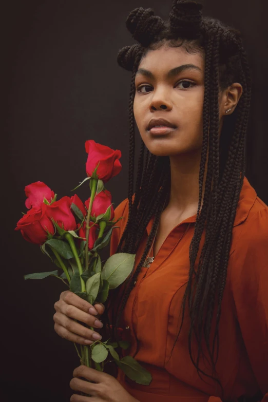 a woman holding a bunch of red roses, pexels contest winner, renaissance, black teenage girl, ((portrait)), warm hues, serious