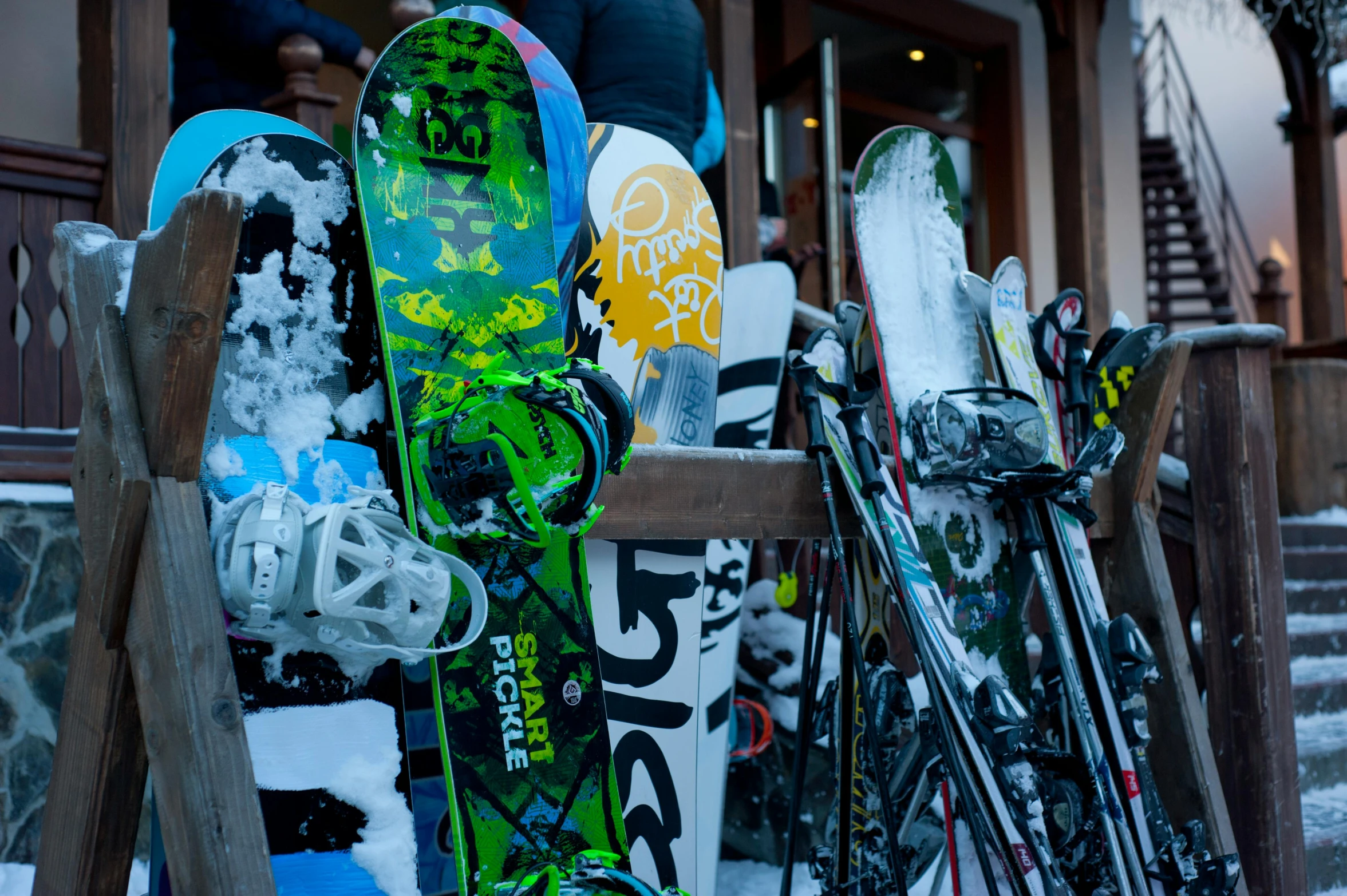 a group of snowboards sitting on top of a wooden fence, pexels, avatar image, close-up photo, exterior photo, whistler