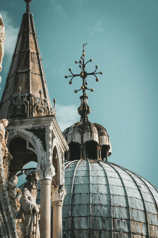 a couple of statues on top of a building, by Canaletto, pexels contest winner, baroque, neoclassical tower with dome, venice, flying buttresses, interior of a marble dome