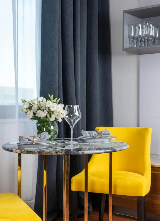 a couple of yellow chairs sitting next to a table, silver gold details, breakfast, luxury condo interior, neo kyiv