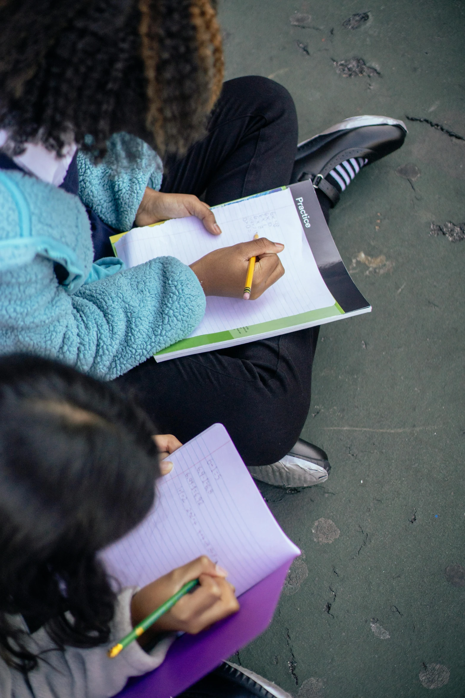 a group of children sitting next to each other on the ground, a child's drawing, quito school, holding notebook, thumbnail, close-up photo, multiple stories