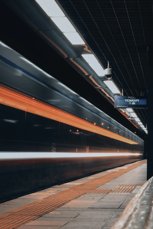 a train traveling down a train track next to a platform, by Alejandro Obregón, unsplash contest winner, square, hyperspeed, on black background, high traffic