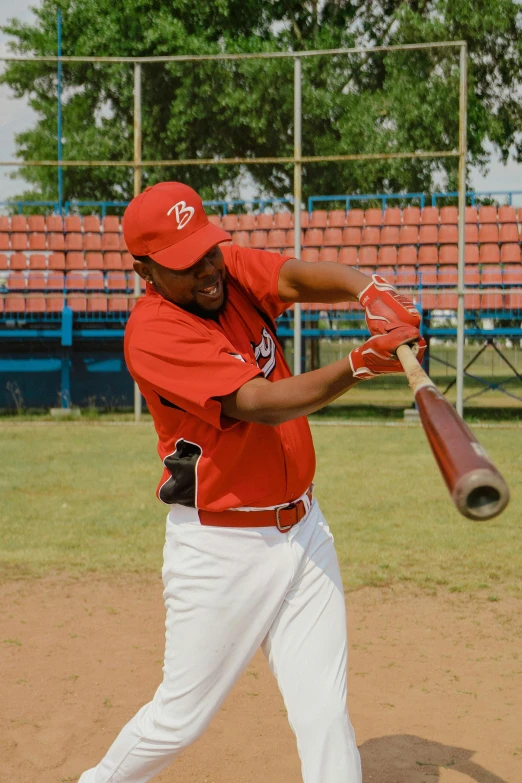 a baseball player swinging a bat at a ball, pexels contest winner, cuba, working out in the field, square, reds)