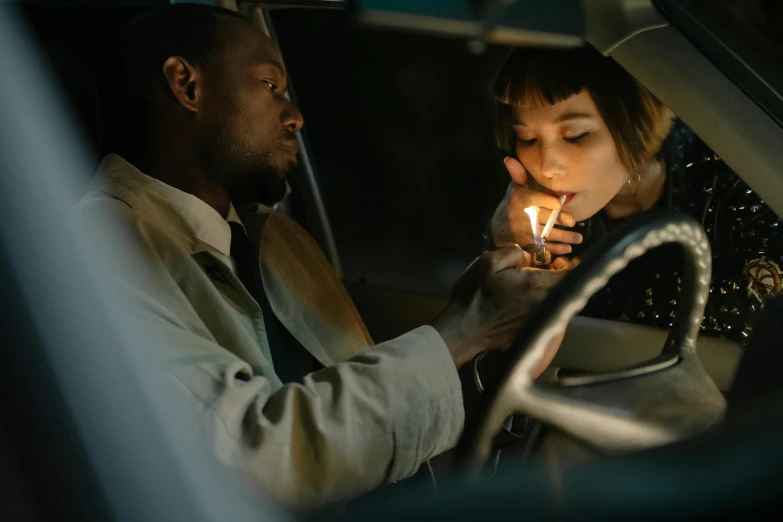 a man and a woman sitting in a car, inspired by Elsa Bleda, pexels contest winner, gendo ikari smoking a joint, candlelit, black man, ( ( theatrical ) )