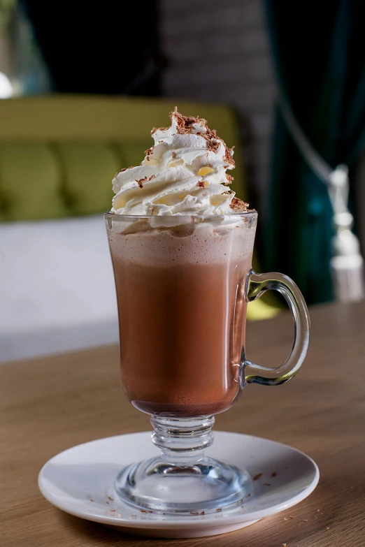 a close up of a cup of coffee on a table, whipped cream, fully chocolate, hurricane, lounge