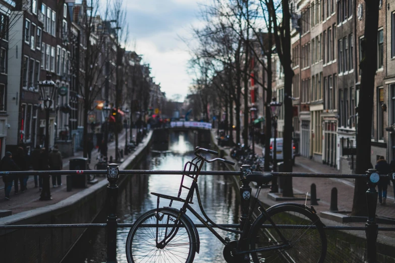 a bicycle parked on a bridge over a canal, pexels contest winner, de stijl, dingy city street, thumbnail, city backdrop, 🚿🗝📝