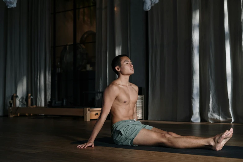 a shirtless man sitting on a yoga mat, unsplash, light and space, asian man, 千 葉 雄 大, instagram post, high quality upload