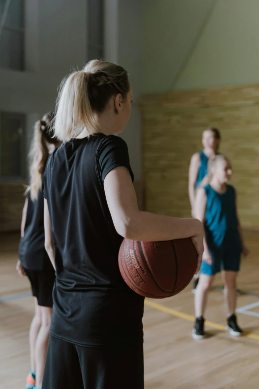 a group of women playing a game of basketball, 15081959 21121991 01012000 4k, focused photo, medium head to shoulder shot, for junior