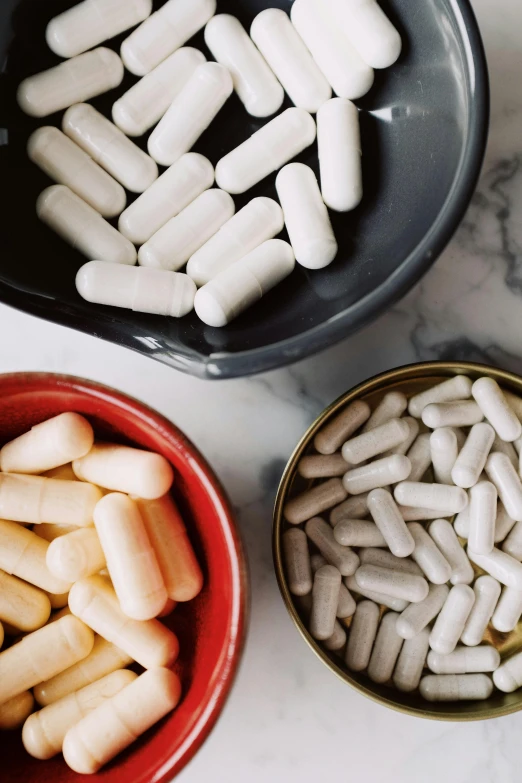 a couple of bowls filled with white pills, unsplash, instagram post, ilustration, ben mauro, rockets