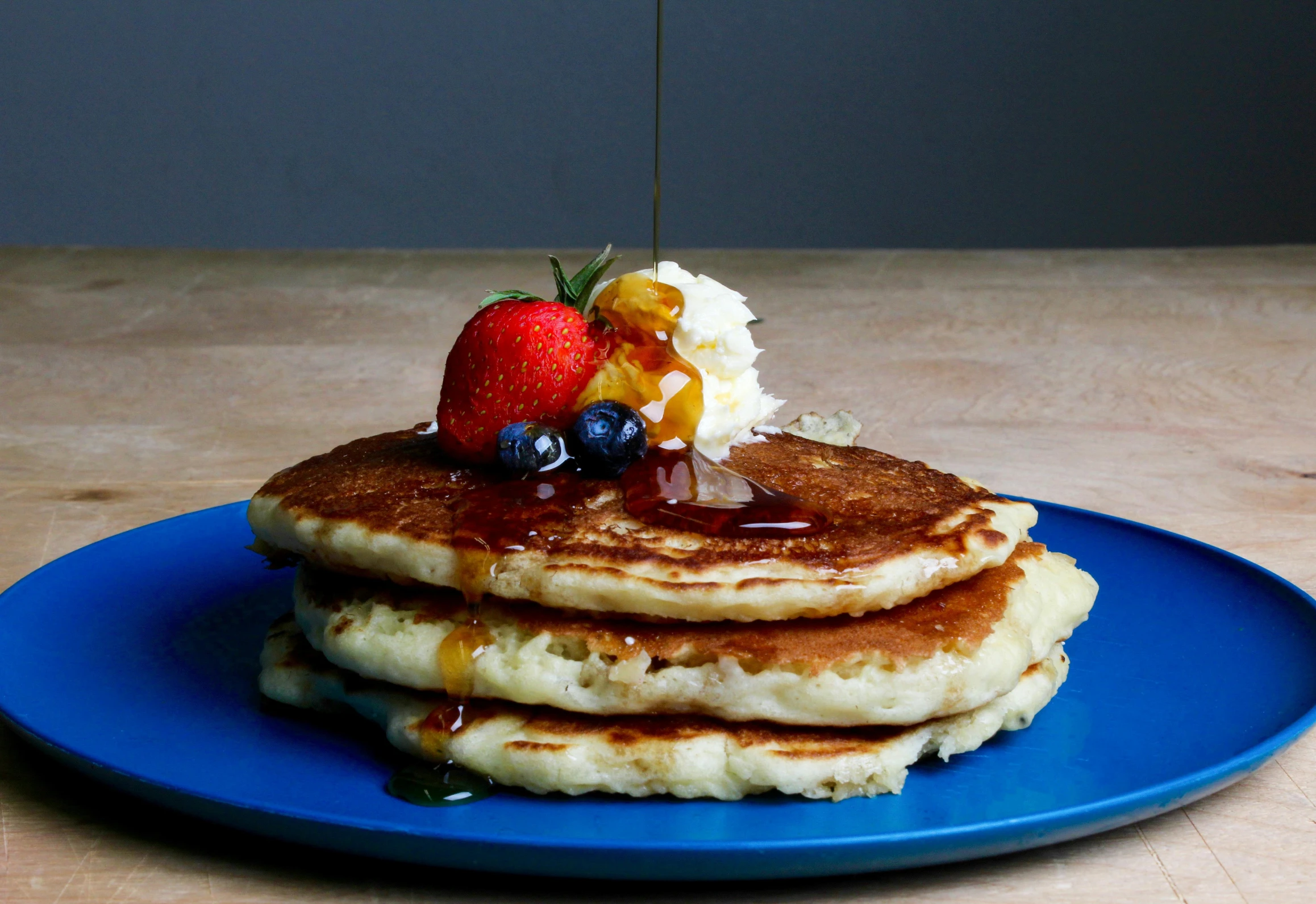 a stack of pancakes sitting on top of a blue plate, by Jim Nelson, squashed berries dripping, trio, handcrafted, thumbnail