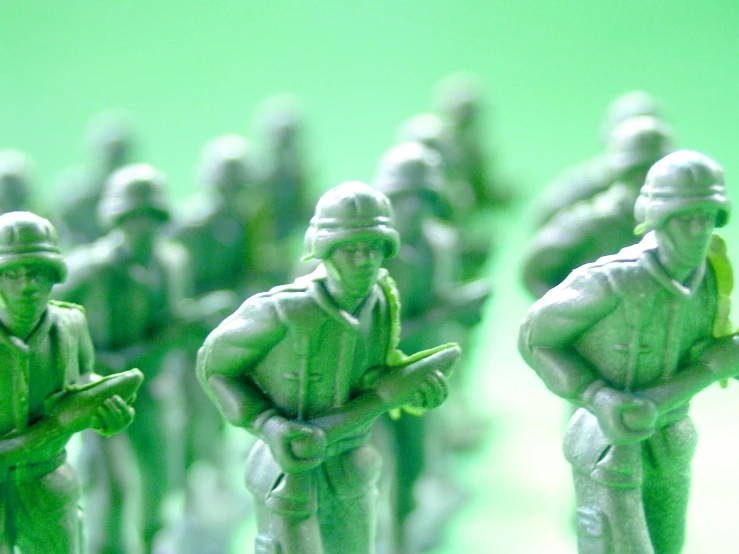 a group of toy soldiers standing next to each other, green, zoomed in, small, video