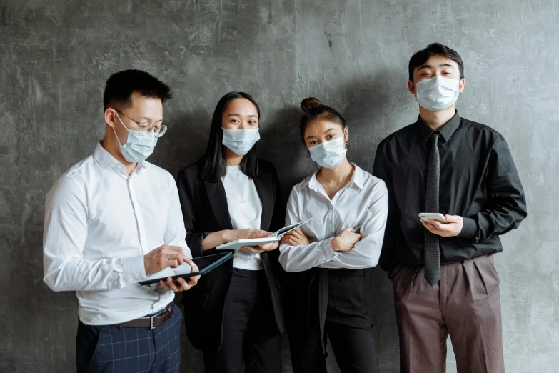 a group of people standing next to each other, a picture, trending on pexels, medical mask, corporate style, asian human, title