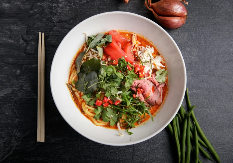 a close up of a bowl of food with chopsticks, profile image, reds, full product shot, bangkuart