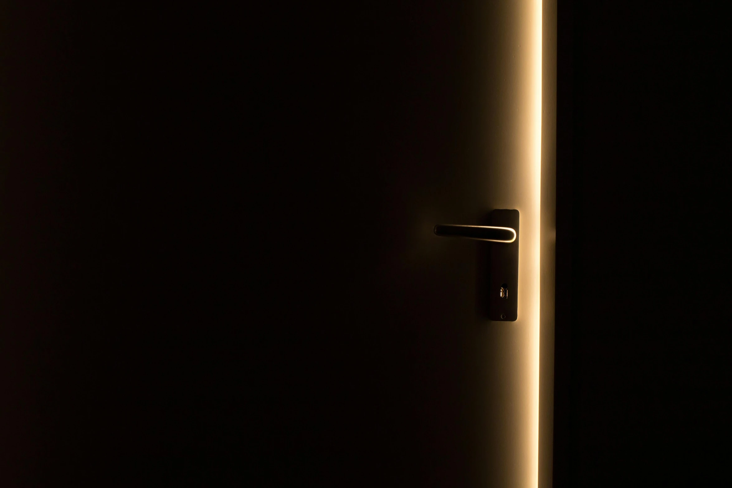 a close up of a door in a dark room, by Thomas Häfner, light and space, nightlight, warm illumination, metallic light, key lighting