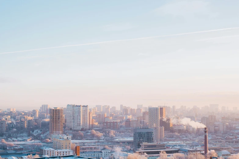 a view of a city from the top of a hill, pexels contest winner, socialist realism, cold colour temperature, pastel hues, winter photograph, 000 — википедия