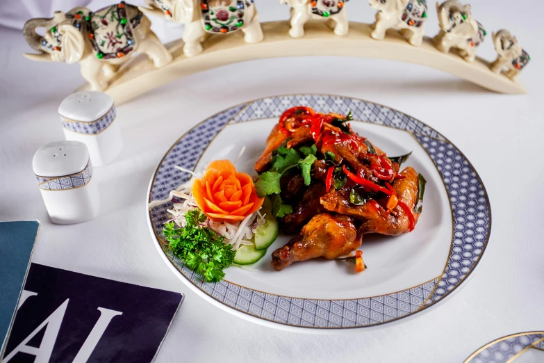 a close up of a plate of food on a table, inspired by Li Kan, unsplash, cloisonnism, each having six wings, chicken, high resolution product photo, white