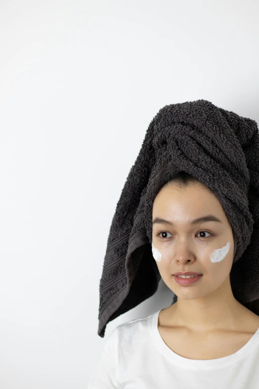 a woman with a towel wrapped around her head, detailed product image, asian features, white facepaint, manuka