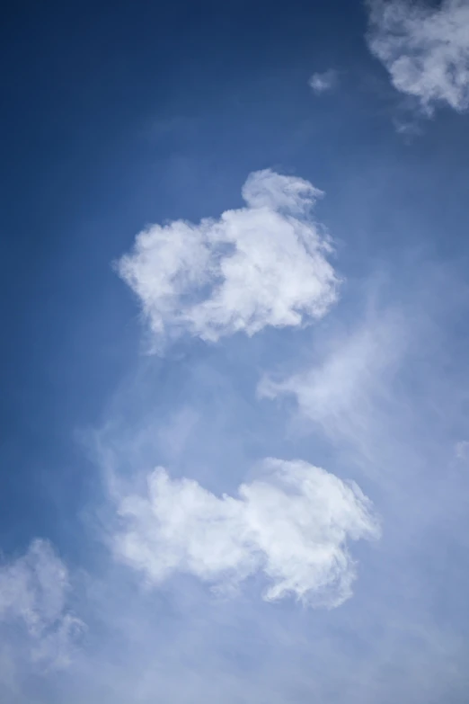 a man riding a snowboard on top of a snow covered slope, inspired by Rene Magritte, unsplash, minimalism, cumulus cloud tattoos, question marks, white fluffy cloud, hearts