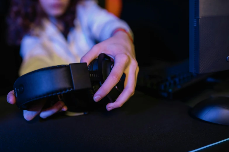 a close up of a person holding a pair of headphones, a digital rendering, unsplash, gaming room, fanatec peripherals, instagram picture, avatar image